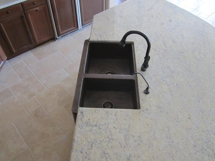 Installation of hammered copper farmhouse sink